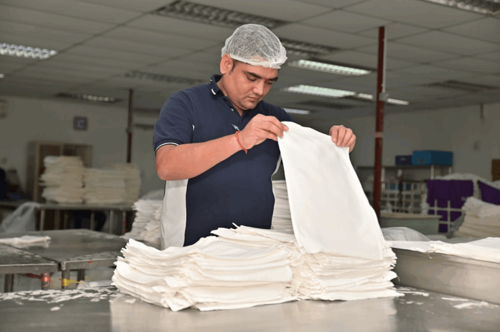 Mas Aero Experince Staff folding clothes which are washed for commercial airlines Mas Aero Experince Staff folding clothes which are washed for commercial airlines